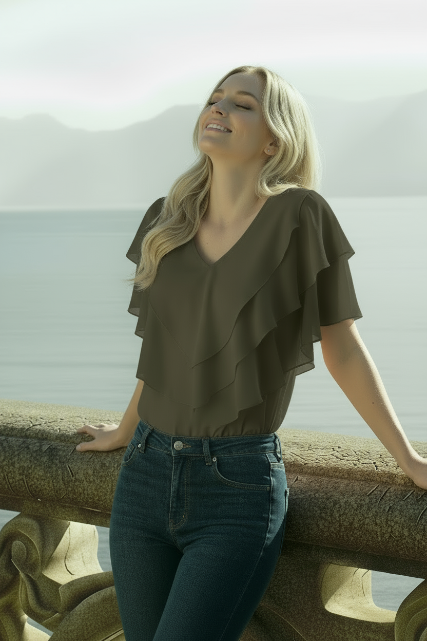 Model wearing khaki Ciel blouse with V-neck and chiffon fabric