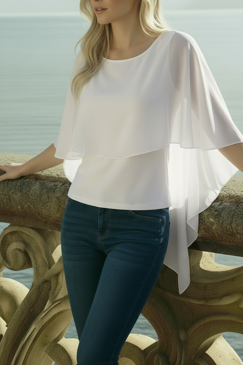 Model wearing bone white ruffle chiffon blouse with flowing volan layers