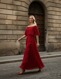 Model wearing red Daila maxi dress with off-shoulder neckline and A-line silhouette