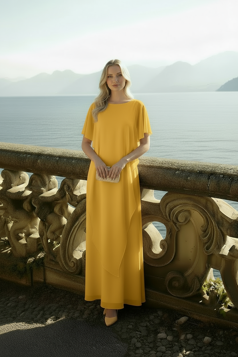 Back angle of yellow Celeste kaftan dress highlighting relaxed A-line fit