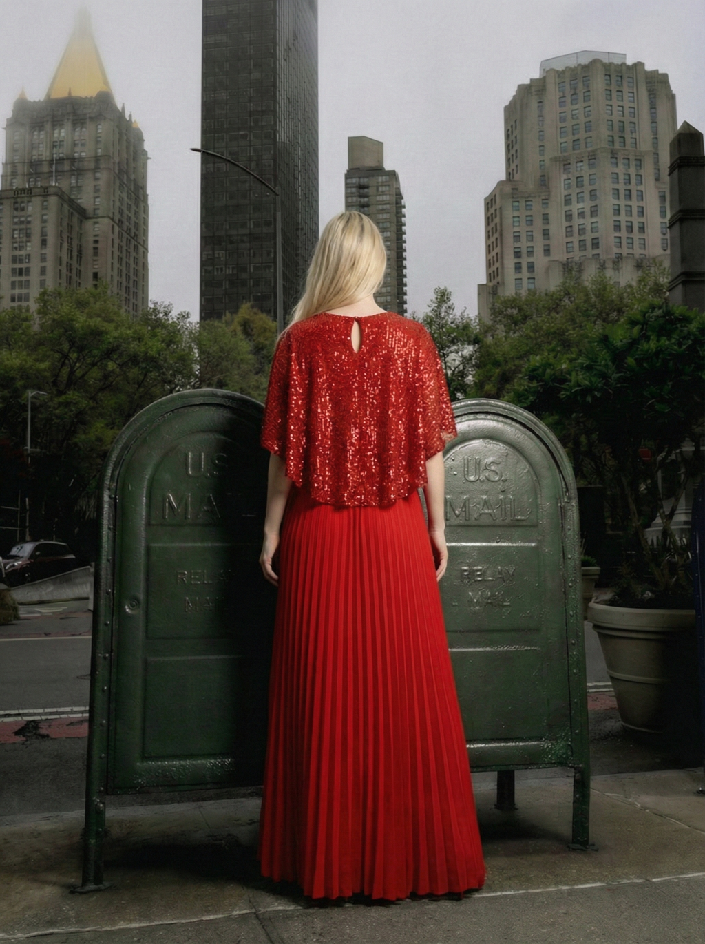 Back view of Viva red sequin pleated maxi evening dress with cape overlay and flowing skirt, elegant formal gown, Limsa Club