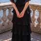 Limsa Club Astra V-Neck Pleated Evening Gown in Black — close-up detail
