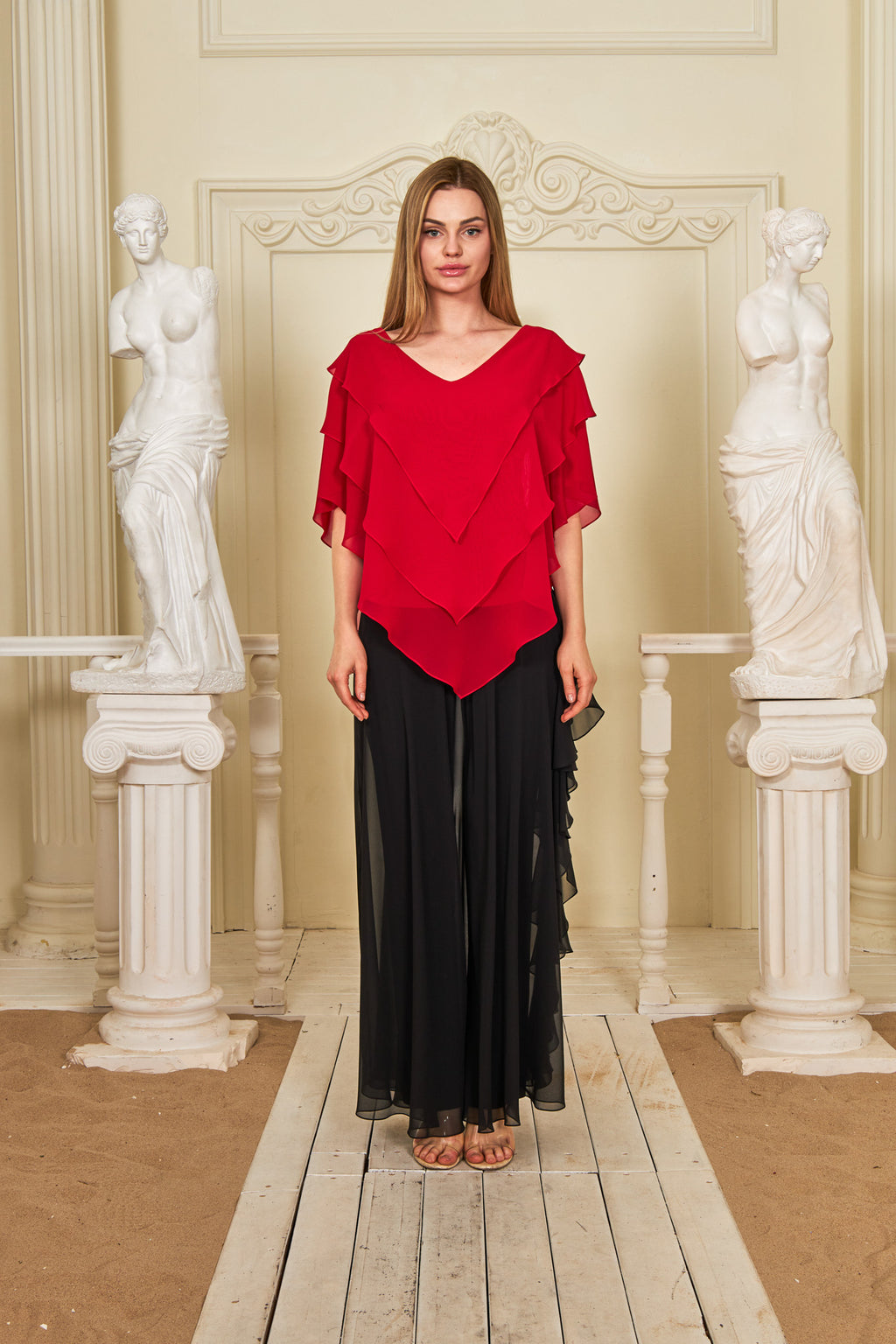 Model wearing the Elora Blouse paired with a flowing black skirt, showcasing the stylish modern blouse.